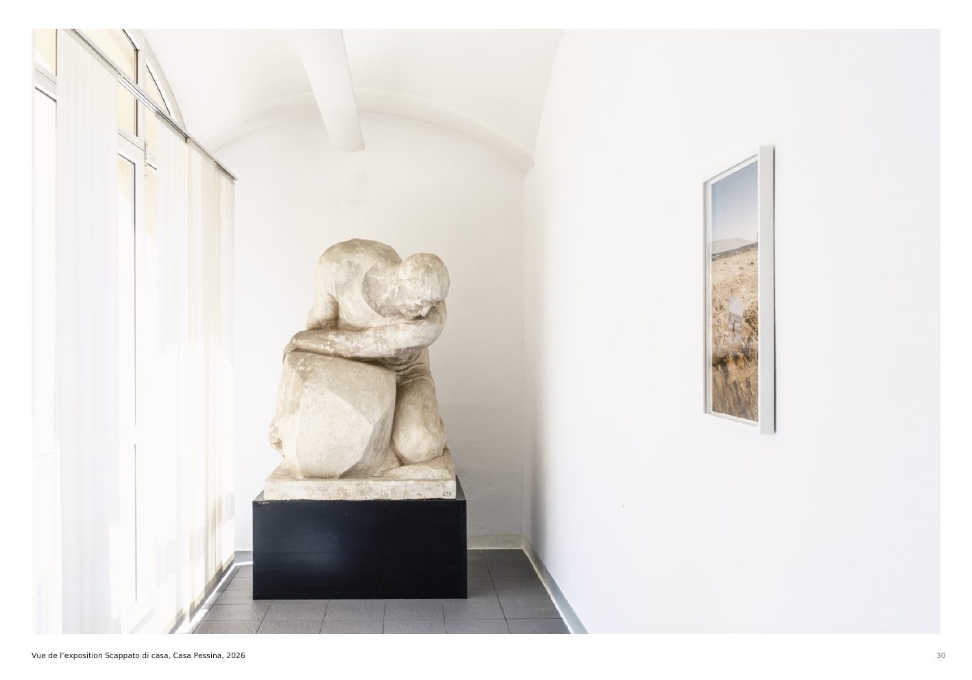 Installation view of Scappato di casa with sculpture and photographs at Casa Pessina, 2026